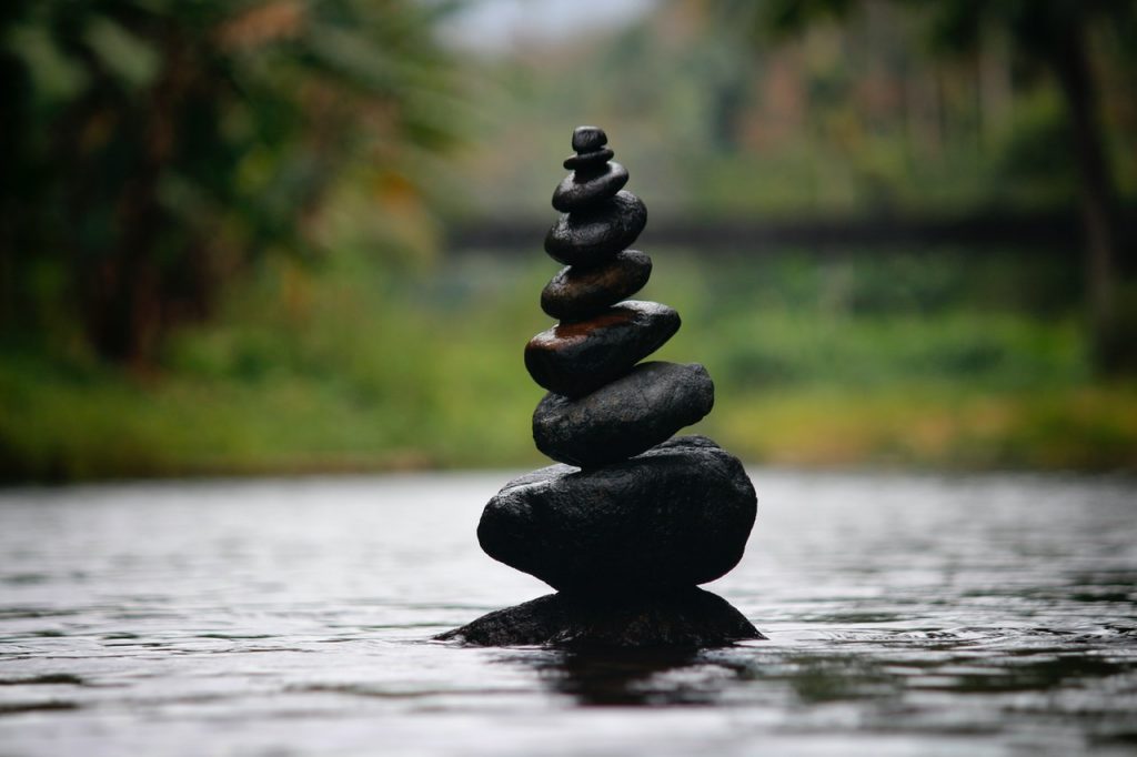 stacked stone tower in water
