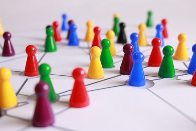 multicolored game pieces in a network