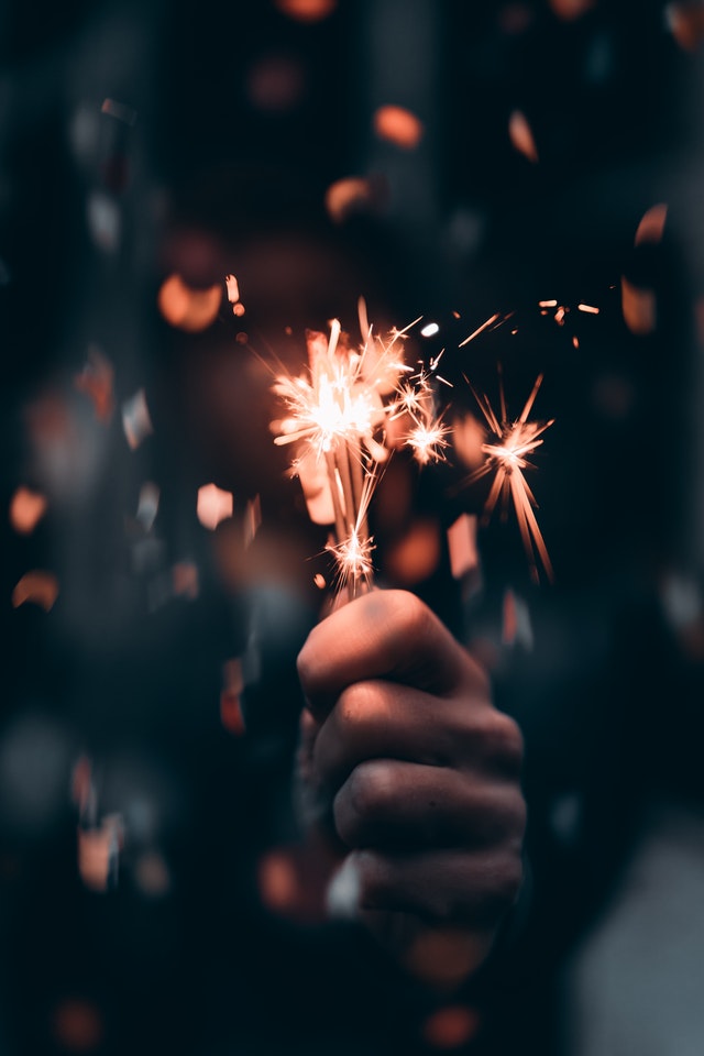 hand holding firework sparkler