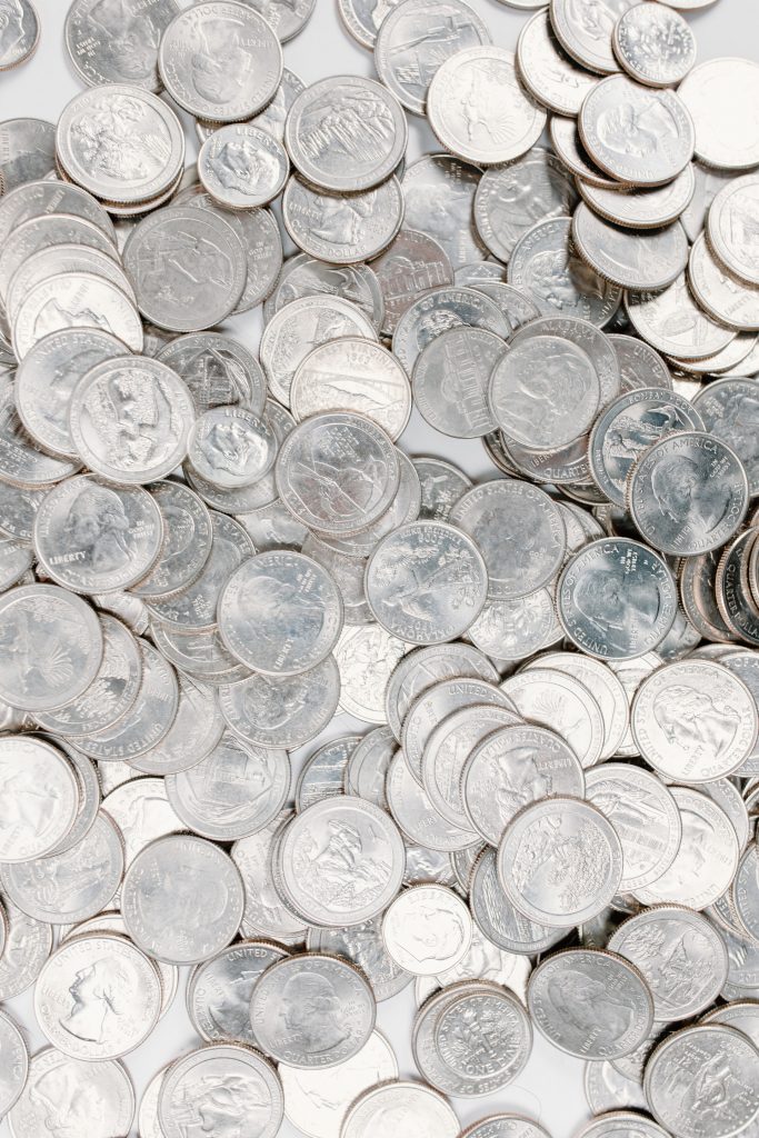 Pile of US Quarters spread out on a table